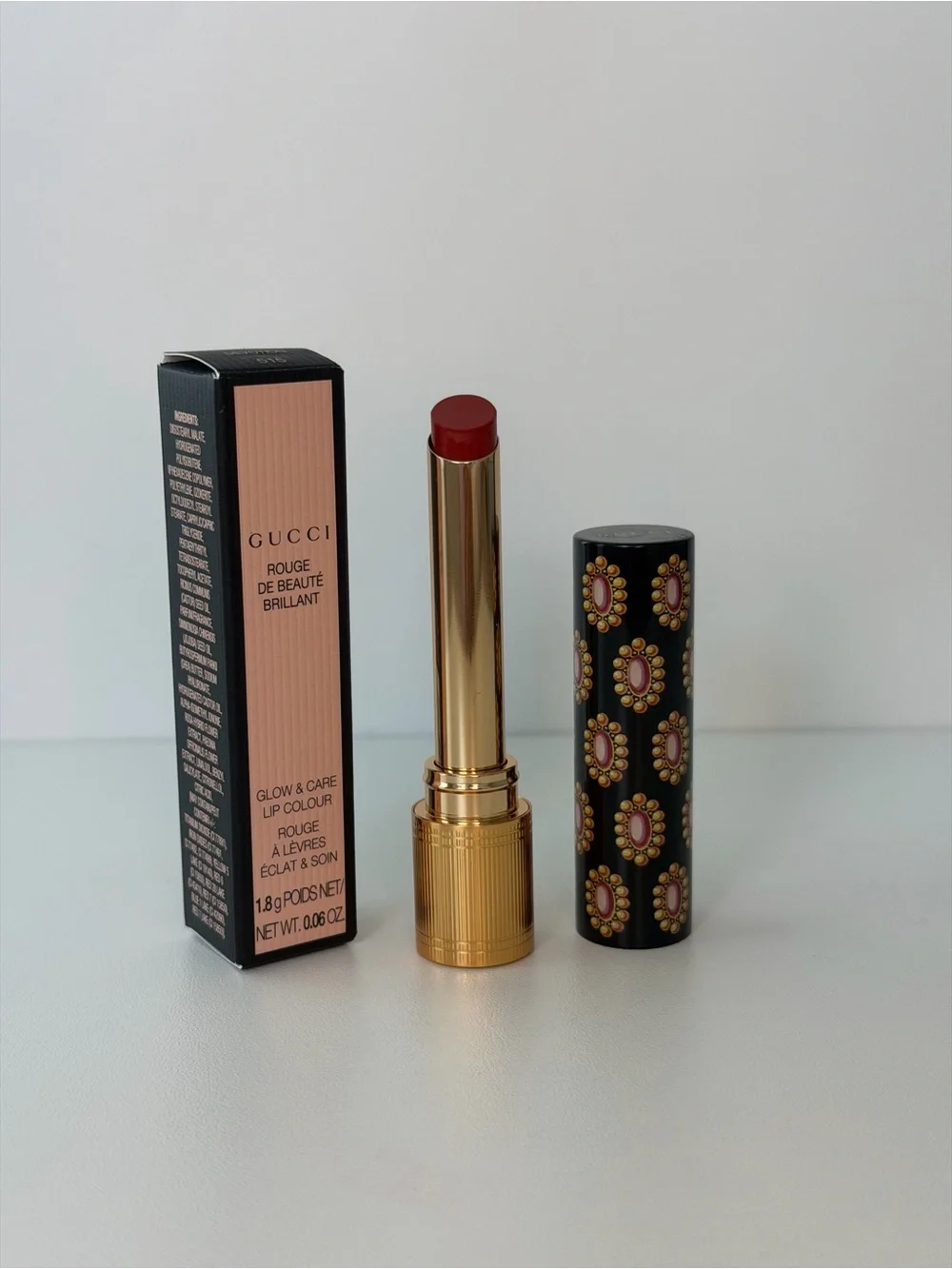 Gucci Lipstick in Deep Red with Gold Case and Patterned Black Cap